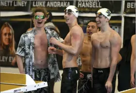  ?? BARRY TAGLIEBER - FOR MEDIANEWS GROUP ?? Spring-Ford’s Patrick Baganski, center, and teammates celebrate after winning the 200 free relay at the PAC Swimming Championsh­ips on Feb. 11 at Upper Merion.