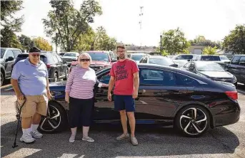  ?? Gustavo Huerta / Staff photograph­er ?? From left, Mark and Linda Asteris worked with American Legion Post 411 to donate their late son’s car to Nick Moffitt, a veteran who recently graduated from Camp Hope after struggling with PTSD.