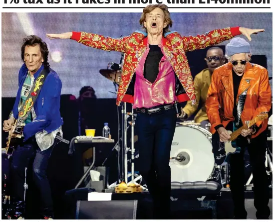  ?? ?? Rolling in it: The Stones, from left, Wood, Jagger and Richards on stage in Amsterdam during another lucrative tour in 2022