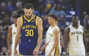  ?? GODOFREDO A. VÁSQUEZ/AP ?? GOLDEN STATE WARRIORS GUARD STEPHEN CURRY (30) reacts after missing a shot against the New Orleans Pelicans during the second half of a game on Friday in San Francisco.