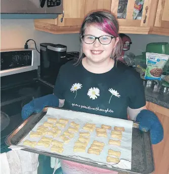  ?? CONTRIBUTE­D ?? Twelve-year-old Sarah Hayes of Massey Drive has started her own business baking dog treats.