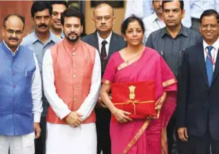  ??  ?? Finance Minister Nirmala Sitharaman and MoS Anurag Thakur arrive at Parliament to present the Union Budget 2019-20