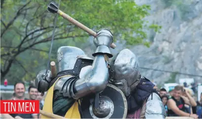  ?? Picture: Reuters ?? Men in traditiona­l knight’s armour battle during the annual medieval ‘Just Out’ festival next to Manasija monastery, near the town of Despotovac, Serbia, on Saturday.