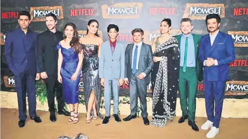  ??  ?? The Indian cast of ‘Mowgli’ pose with Andy Serkis (second right) at the premiere.