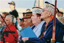  ?? Audrey Mcavoy/associated Press ?? Pearl Harbor survivors and other military veterans observe a ceremony on Wednesday in Pearl Harbor, Hawaii.