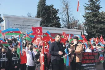  ??  ?? Students commemorat­e the 29th anniversar­y of the Khojaly Massacre, in Istanbul, Turkey, Feb. 26, 2021.