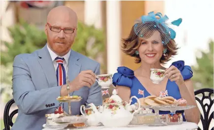  ?? HBO ?? Cord Hosenbeck (Will Ferrell) and Tish Cattigan (Molly Shannon) tip their cups to the couple on “Royal Wedding Live.”