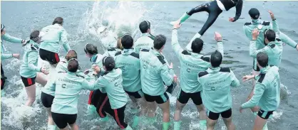  ??  ?? Hugo Ramambason cox for the Cambridge University Men’s Boat Club Blue crew and Sophie Shapter cox for the Cambridge University Women’s Boat Club Blue crew are thrown into the River Thames after The Cancer Research UK Boat Race 2018