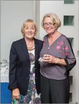  ??  ?? Mary O’Carroll, a winner in the Lady President’s Prize competitio­n at Blainroe Golf Club, receives her prize from Lady President Bernie Nelson.