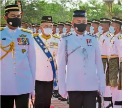  ?? — Bernama ?? Stately splendour: Ali (centre) inspecting the guard of honour at the investitur­e ceremony in conjunctio­n with his 71st birthday at the Balai Istiadat, Seri Negeri Ayer Keroh. (Right) Muthiah receiving the Darjah Pangkuan Seri Melaka award.