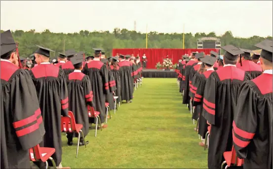  ?? Photo contribute­d by Gail Conner ?? Cedartown High School graduates get ready for the start of ceremonies May 27 on Doc Ayers Field as family and friends looked on.