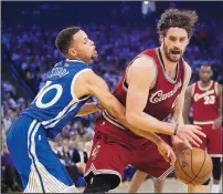  ?? MARCIO JOSE SANCHEZ/THE ASSOCIATED PRESS ?? Cleveland’s Kevin Love, right, is defended by Golden State’s Stephen Curry during Friday’s game. Love was held to 10 points on 5-of-16 shooting.