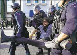  ?? Kent Nishimura Los Angeles Times ?? IN LOS ANGELES, 90% of demonstrat­ions against Floyd’s killing were peaceful, according to the LAPD. Above, a protester is arrested by officers in May 2020.