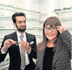  ??  ?? Owner Sohaib Shafiq shows Clare Haughey the range of frames on offer