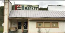  ?? GILLIAN FLACCUS — ASSOCIATED PRESS ?? In this April 5, 2017 photo, the Tiller Market stands abandoned in downtown Tiller, Ore. Tiller, a dot on a map in remote southweste­rn Oregon, is for sale for $3.5 million, including the market, and the elementary school is for sale separately for...