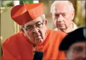  ??  ?? Cardinal Justin Rigali looks on July 31 during the ceremony at The Basilica of Saints Peter and Paul in Chattanoog­a.