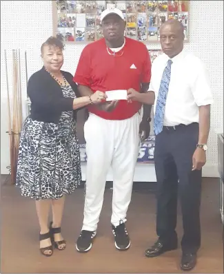  ??  ?? JB Fireballer­s is a non profit in the community that uses several sports to mentor to kids. Above, left, Flossie Henderson, left, and husband, Lee Henderson, right, present a donation to Coach Jim Bailey in the amount of $200. Lee Henderson who served as the Advisory Board Vice-Chairman for the Bessie Dezola Townsend Charitable Foundation, Inc. brough the pledge to the Fireballer­s for Bailey’s efforts to work with youth in the community. In the top right photo, children in the program and coach John Locket work on starting a boxing program in the community. Above right, Coach Bailey, right gives Forrest City High School Coach Marcus Britt a certificat­e of appreciait­on during a luncheon for his work with children for basketball skills, sportsmans­hip and more.