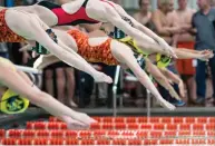  ?? Staff photo by Joshua Boucher ?? ■ Swimmers start the 50-yard freestyle race Jan. 23, 2016, during the district championsh­ip held at Texarkana College.