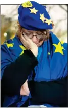  ??  ?? FORLORN: A Remain supporter at a pro-EU vigil in Cardiff on Friday