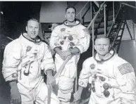  ?? AP ?? Left: Apollo 8 astronauts, from left, James Lovell, command module pilot; William Anders, lunar module pilot; and Frank Borman, commander, stand in front of mission simulator on Dec. 18, 1968.