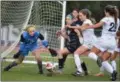  ?? BARRY TAGLIEBER - FOR DIGITAL FIRST MEDIA ?? Phoenixvil­le’s goalie Ella Stout makes a stop on Villa Maria’s Maddie Byrne and Grace McLees.