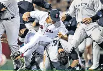  ??  ?? Brawl: Red Sox pitcher Joe Kelly and Yankees’ Tyler Austin