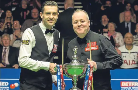  ?? Picture: PA. ?? Four-times champion John Higgins, right, prior to the start of the final with opponent Mark Selby.