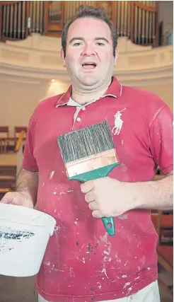  ??  ?? Glossy performer…decorator John in full voice in the church