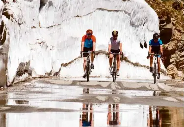  ??  ?? Right: On the final approach to the summit the road can be slick with water from the melting banks of ice