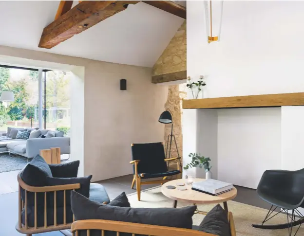  ??  ?? SEATING AREA
This space (above) next to the kitchen is a favourite place for watching television (which sits to the right of the chimney breast). The Gellings chose the oversized armchairs as they each seat an adult and one child comfortabl­y.
Fly...