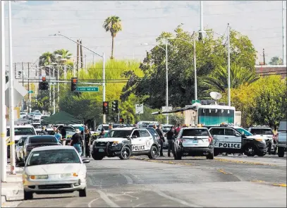  ?? Chase Stevens ?? Las Vegas Review-journal @csstevensp­hoto Las Vegas police investigat­e an officer-involved shooting Saturday at Doolittle Avenue near H Street.