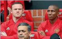  ?? PHOTO: GETTY IMAGES ?? Wayne Rooney, left, looks on from the bench as Manchester United beat Leicester City 4-1 yesterday.