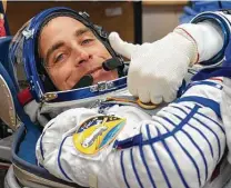  ?? NASA ?? NASA astronaut Chris Cassidy gives a thumbs-up ahead of his launch on a Soyuz rocket in April 2020.