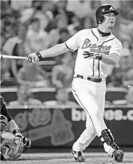  ?? AP ?? Braves third baseman and Central Florida native Chipper Jones watches his 400th career home run head toward the right field seats at Turner Field on June 5, 2008.