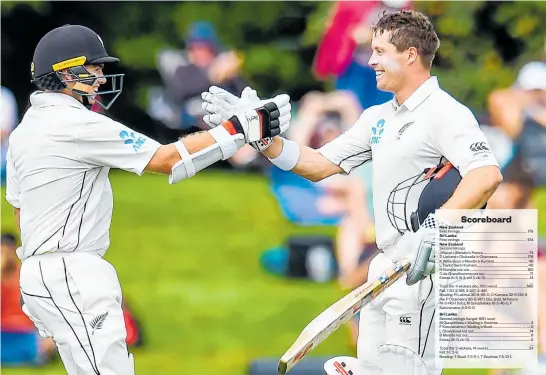  ?? Photo / Photosport ?? Black Caps opener Tom Latham (left) congratula­tes Henry Nicholls on reaching his century in Christchur­ch yesterday. Latham made 176, Nicholls reached 162 not out.