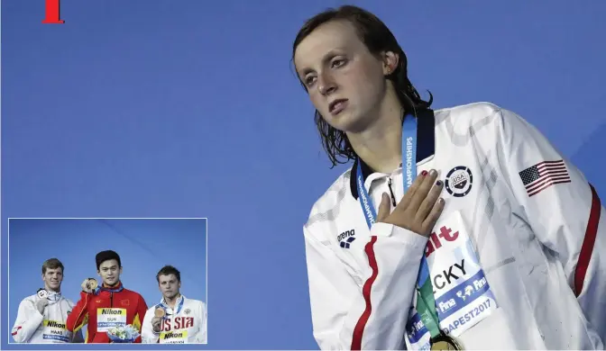  ?? — AFP ?? BUDAPEST: US Katie Ledecky celebrates on the podium after the women’s 1500m freestyle final during the swimming competitio­n at the 2017 FINA World Championsh­ips in Budapest, yesterday. (Inset) (R-L) Russia’s Aleksandr Krasnykh, China’s Sun Yang and US...