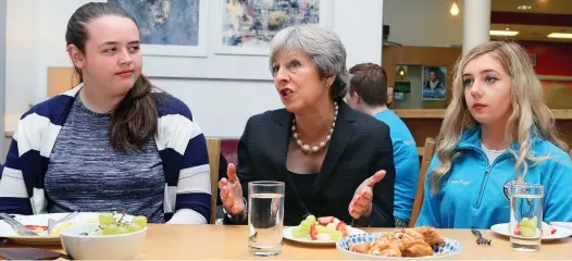  ??  ?? Vision: Theresa May meets students yesterday in Belfast, where she was setting out her Brexit proposals