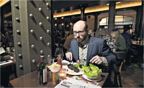  ??  ?? Single course: James Hall enjoys a spot of ‘me time’ by dining solo in Hawksmoor restaurant, central London