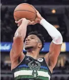  ?? AP ?? Bucks forward Giannis Antetokoun­mpo shoots a free throw against the Bulls on Sunday.