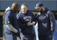  ?? STEVEN SENNE - THE ASSOCIATED PRESS ?? FILE - In this Jan. 19, 2017, file photo, New England Patriots head coach Bill Belichick, center, speaks with linebacker­s coach Brian Flores, left, and defensive line coach Brendan Daly during an NFL football team practice, in Foxborough, Mass.