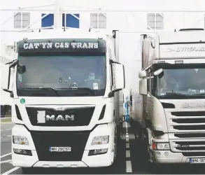  ?? SAMEER AL-DOUMY / AFP ?? Truck drivers wait in Calais to sail for Britain, whose exit from the EU has resulted in
trade disruption as exporters and shippers scramble to meet new regulation­s.