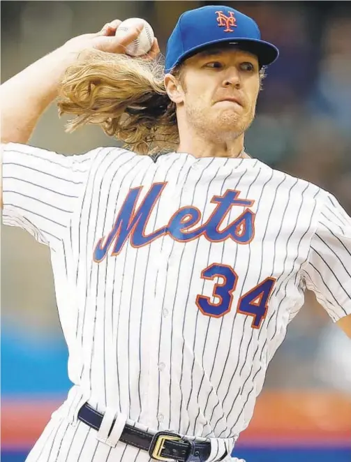  ?? AP ?? With no guidelnes in CBA, Noah Syndergaar­d likely would have been forced to cut trademark locks to adhere toYankees’ grooming policy.