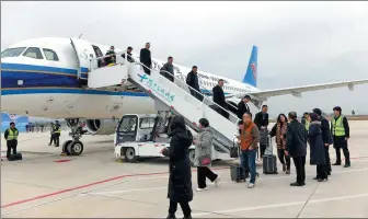  ?? WANG YUGUI / FOR CHINA DAILY ?? Passengers get off a China Southern plane at Langzhong Gucheng Airport in Nanchong, Sichuan province.