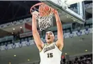  ?? CHRISTOPHE­R KATSAROV/THE CANADIAN PRESS VIA AP ?? Purdue center Zach Edey dunks during the second half against Alabama on Saturday in Toronto.