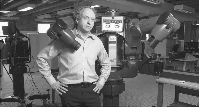  ?? EVAN MCGLINN/ THE NEW YORK TIMES ?? Rodney Brooks, founder of Rethink Robotics, has developed Baxter, a two-armed robot that changes facial expression­s, looks friendly and is capable of working with humans in manufactur­ing.