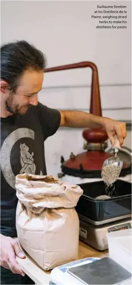  ??  ?? Guillaume Strebler at his Distilleri­e de la Plaine, weighing dried herbs to make his distillate­s for pastis