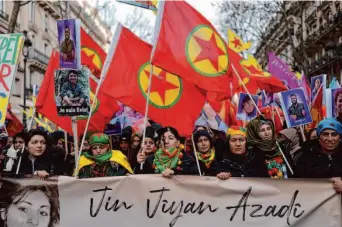  ?? Lewis Joly/Associated Press ?? Kurdish activists rally in Paris to protest the killings of three activists in the French capital 10 years ago and to mourn three people killed last month near a Kurdish cultural center in Paris.