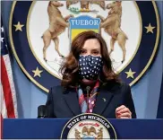  ?? MICHIGAN OFFICE OF THE GOVERNOR VIA AP ?? In a photo provided by the Michigan Office of the
Governor, Gov. Gretchen Whitmer addresses the state during a speech in Lansing. The governor announced the further loosening of Michigan’s coronaviru­s restrictio­ns, easing capacity limits in restaurant­s and a host of other businesses while also allowing for larger indoor and outdoor gatherings. The revised state health department order will take effect today and last through April 19.