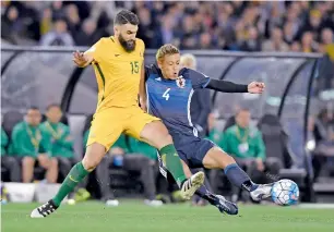  ?? AFP file ?? Australia’s Mile Jedinak (left) and Japan’s Keisuke Honda contest for the ball during their World Cup qualifying match in Melbourne last year. —
