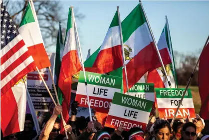  ?? Photograph: Allison Bailey/NurPhoto/REX/Shuttersto­ck ?? People march near the Washington monument during an event in support of protesters in Iran on 26 November 2022.